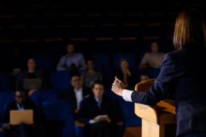 Speaker Addressing Audience at a Conference