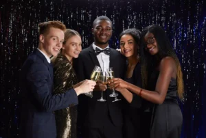 Group of friends celebrating prom, enjoying a luxury limo service with Noor Limousine LLC.