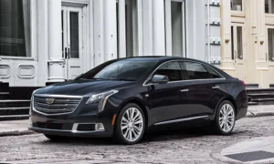 Luxury Cadillac XTS sedan available for rent, offering premium transportation services with Noor Limousine LLC.